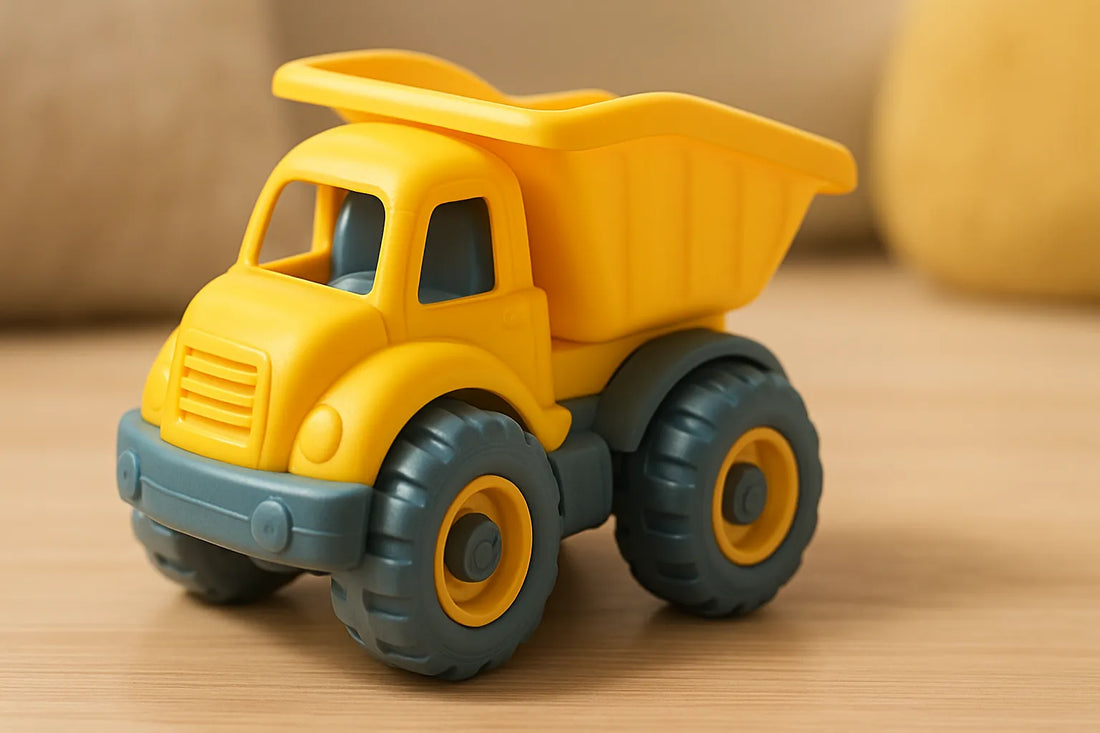 Bright yellow BPA-free mini toy dump truck for toddlers on a wooden surface, designed with chunky wheels and safe edges for indoor play.
